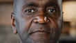 © Yuliia - Close-up portrait african man concentrated human male wrinkled stubbly face american adult 50s retiree businessman ethnic mature patient of ophthalmology health service skincare rejuvenation concept
