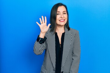 Wall Mural - Middle age hispanic woman wearing business clothes showing and pointing up with fingers number five while smiling confident and happy.