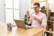 © Krakenimages.com - Young hispanic man having video call communicating with deaf sign language at office