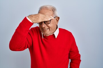 Sticker - Senior man with grey hair standing over isolated background covering eyes with hand, looking serious and sad. sightless, hiding and rejection concept