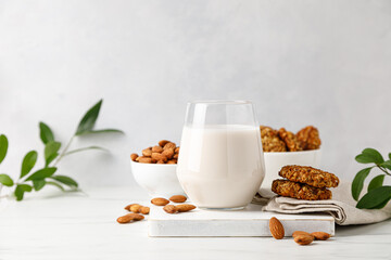 Wall Mural - Almond milk in a glass and almond nuts