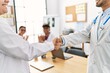 © Krakenimages.com - Group of doctor clapping to partners handshake in a medical meeting at the clinic office.