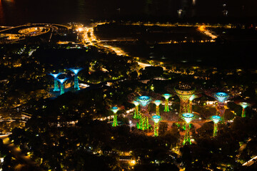 Wall Mural - Singapore city skyline with modern skyscraper architecture building for concept of financial business and travel in Asia cityscape urban landmark, marina bay at night district dusk sky