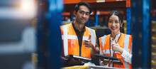 Warehouse Worker And Manager Using Digital Tablet Doing Happy Thumbs Up Gesture With Hand. . Approving Expression Looking At The Camera With Showing Success. Warehouse, Import And Export Concept.