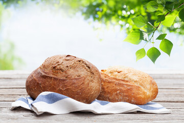 Poster - Homemade bread on wooden table