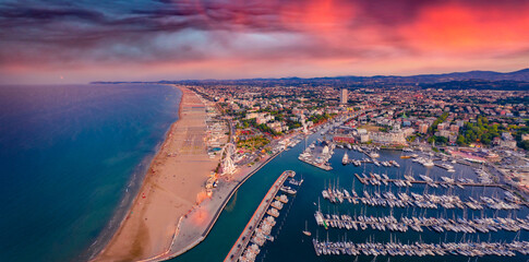 Wall Mural - Panoramic summer view from flying drone of Libera Rimini public beach. Incredible evening scene of Italy, Europe. Spectacular sunset on Adriatic coast. Vacation concept background.