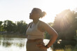 © gpointstudio - Young African American woman breathing after hard workout at the park