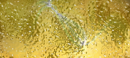 Wall Mural - Transparent colored glass. Golden color rippled background. Abstract liquid metal texture.