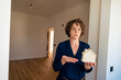 © Westend61 - Real estate agent with model house in new home
