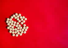 Some Oral Dosage Forms Of Favipiravir, Antiviral Agents, COVID-19, On A Red Background