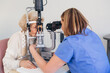 senior woman checking her eyesight in clinic