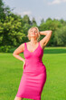 © T.Den_Team - Plus size American blonde woman in pink midi dress at nature. Life of people xl size, happy nice natural beauty woman