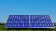 Solar battery of two modules. Renewable electricity. Power plant. Solar battery in front of summer landscape. Renewable electricity supply. Solar battery electricity. Renewable sun modules