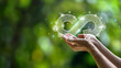 © Dee karen - hand held circular economy icon The concept of eternal circular economy Endless and unlimited for future business growth and design for reuse and environmental sustainability.