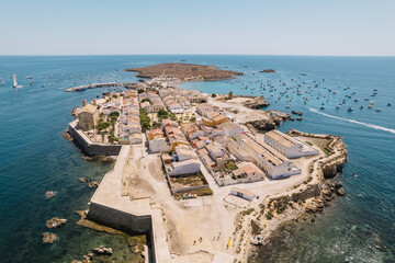 Aerial view of Tabarca island with boats at anchor. Mediterranean Sea. Popular travel destinations at summer. Spain.