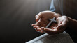 Man's hand with a cross on an open Bible Concept of Hope, Faith, Christianity, Religion, Church, Belief, Forgiveness