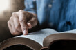© Dee karen - Close-up of a man reading the Bible Spiritual concepts by studying the Holy Scriptures together.