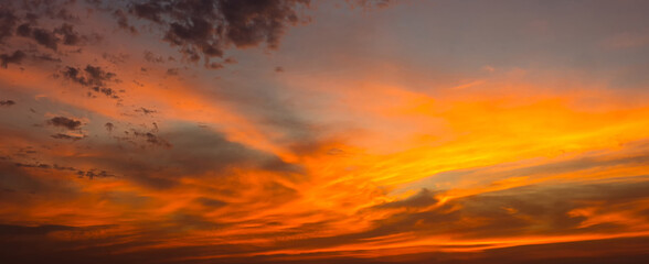 Wall Mural - photo twilight sky background. Colorful Sunset sky and cloud. Vivid sky in twilight time background. Fiery orange sunset sky. Beautiful