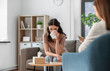 © Syda Productions - psychology, mental health and people concept - crying woman patient wiping tears with paper tissue and psychologist at psychotherapy session