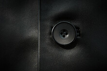 Background Of Leather And Black Buttons. Genuine Leather Jacket Close-up