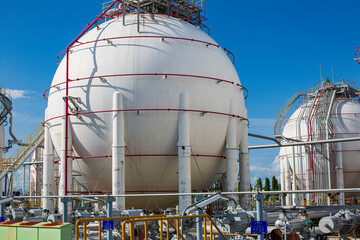 Wall Mural - White spherical propane tanks containing fuel gas industry
