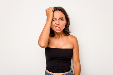 Wall Mural - Young hispanic woman isolated on white background forgetting something, slapping forehead with palm and closing eyes.