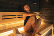 © puhimec - A young woman having rest in sauna alone.