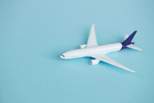 Travel Concept On Blue Background With Copy Space. Airplane Toy On Blue Color Background.