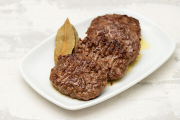 Wall Mural - three fried ground meat on white plate