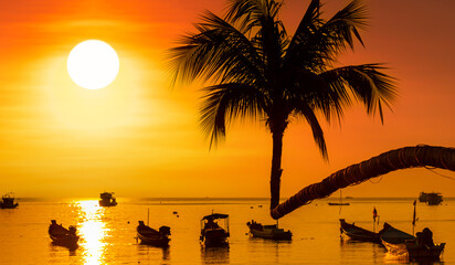 Wall Mural - Sunset on Koh Tao Island. Traditional boats and tropical island landscape. Thailand's famous travel and holiday island. 