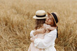 © Kaplitskaya Love - Mom and daughter in a wheat field
