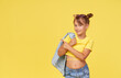 Leinwandbild Motiv Portrait of surprised cute little toddler girl child over yellow background. Looking at camera.  Advertising childrens products.