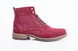 Male red leather boot on white background, isolated product. Differentiated footwear and exclusive design.