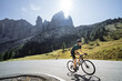 Road cyclist climbing the Italian Dolomites