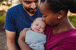 © Kelsey Smith/Stocksy - Newborn with Parents