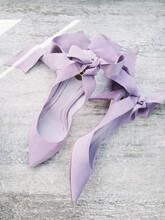 Top View Pair Of Purple Shoes With Bows
