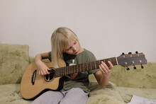  Little Girl Playing Guitar At Home