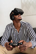 © Ezequiel Giménez/Stocksy - Black man having virtual reality experience