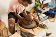 © Guillermo de la Torre/Stocksy - Portrait Of A Male Potter