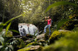 © Luis Herrera/Stocksy - travel woman drinking water outdoors