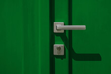Green Colored Door With Handle And Lock Close-up