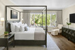 © Trinette Reed/Stocksy - Luxury hotel bedroom with view of nature