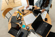 © Valentina Barreto/Stocksy - Coworking desk top view