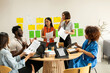 © Valentina Barreto/Stocksy - Work meeting with creative team