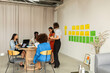 © Valentina Barreto/Stocksy - Casual creative team meeting