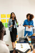 © Valentina Barreto/Stocksy - Mixed young business people meeting