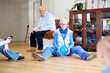 © Guille Faingold/Stocksy - Grandmother playing with her grandson with ball.