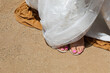 © Shava Cueva/Stocksy - bride with sandals and pink painted nails wearing a wedding dress