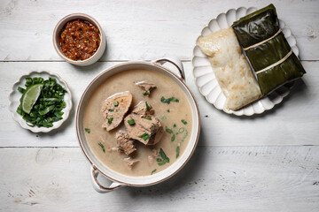 Wall Mural - Coto Makasar is Indonesian traditional food from Makasar, Sulawesi, served with Buras.