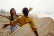 © Jovo Jovanovic/Stocksy - Two friends excited to see each other at the beach